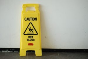 Wet floor sign warns against slip and fall accident