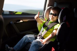 Child in car safety seat in car